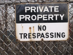 Sign on the fence surrounding the Sterns and Foster demolition site. The streets were however public access.